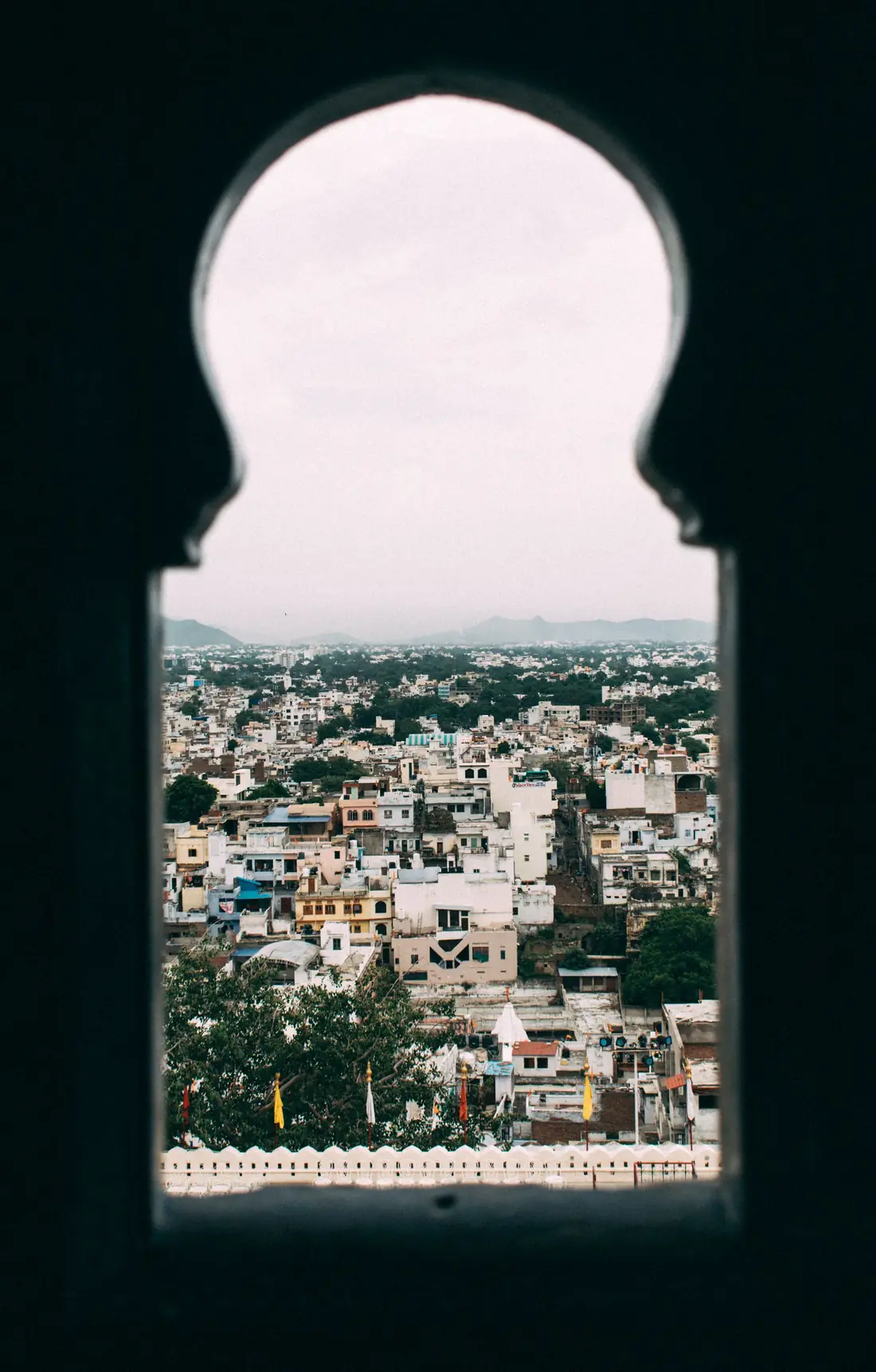 An old town seen through an arched window